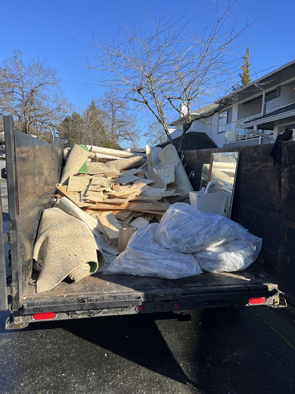 Construction debris cleared floorboards and materials